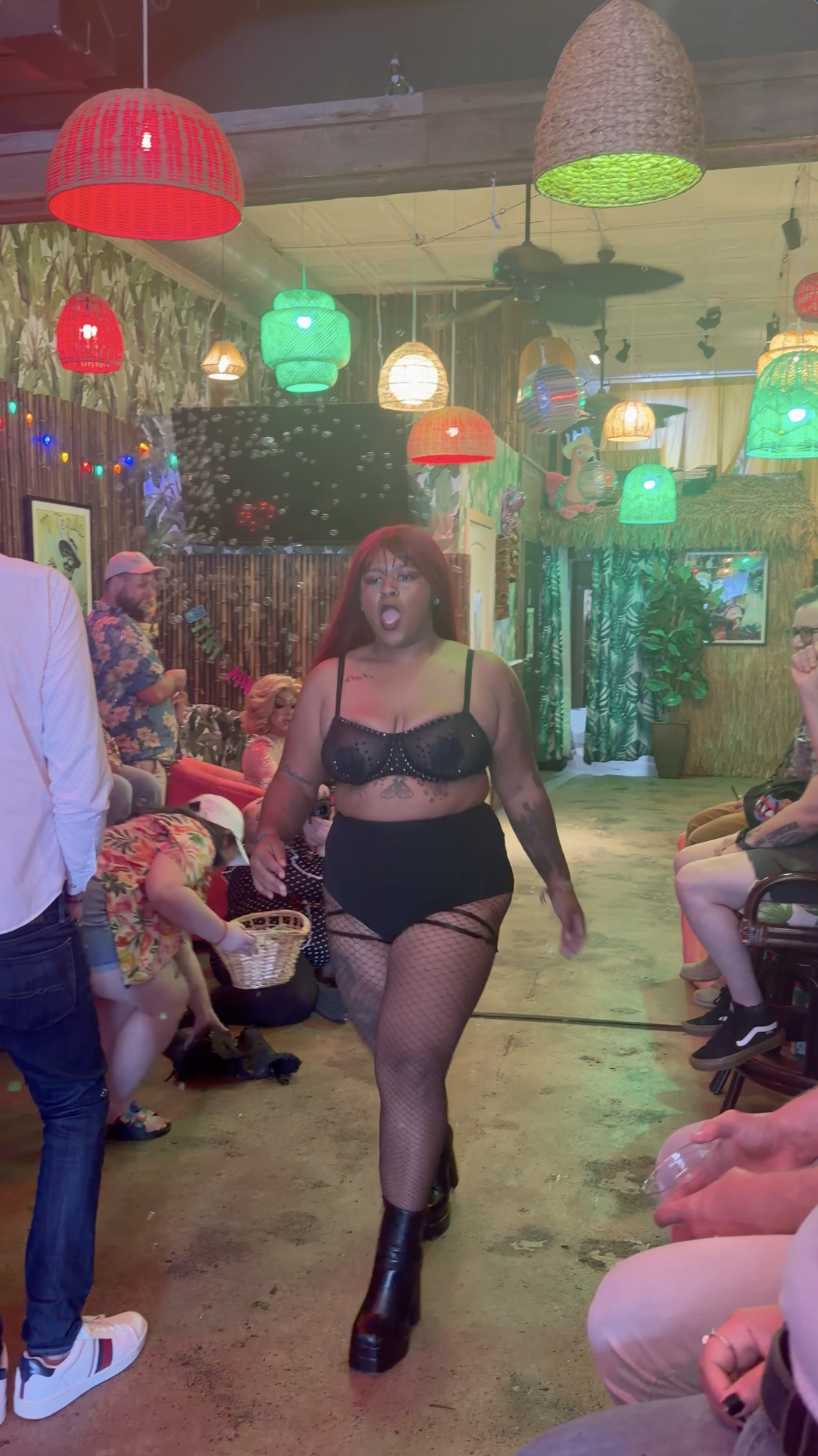 Drag performer walking through Margaritaville Pride Brunch